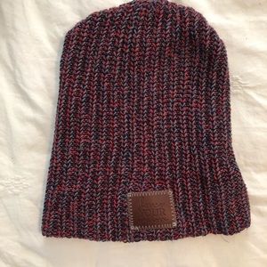 Love Your Melon beanie in red, blue and grey